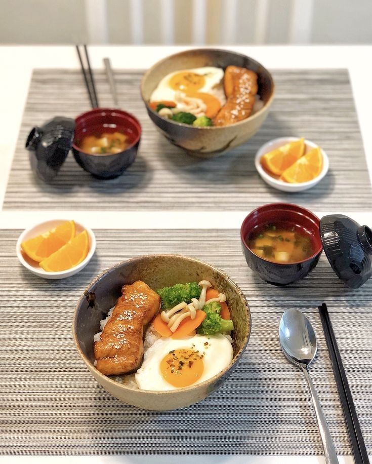 a table topped with bowls filled with different types of food