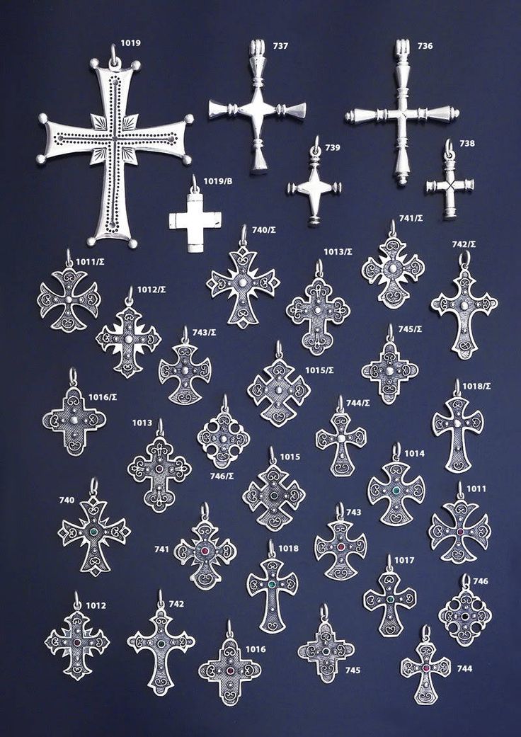 an assortment of crosses are shown on a blue background