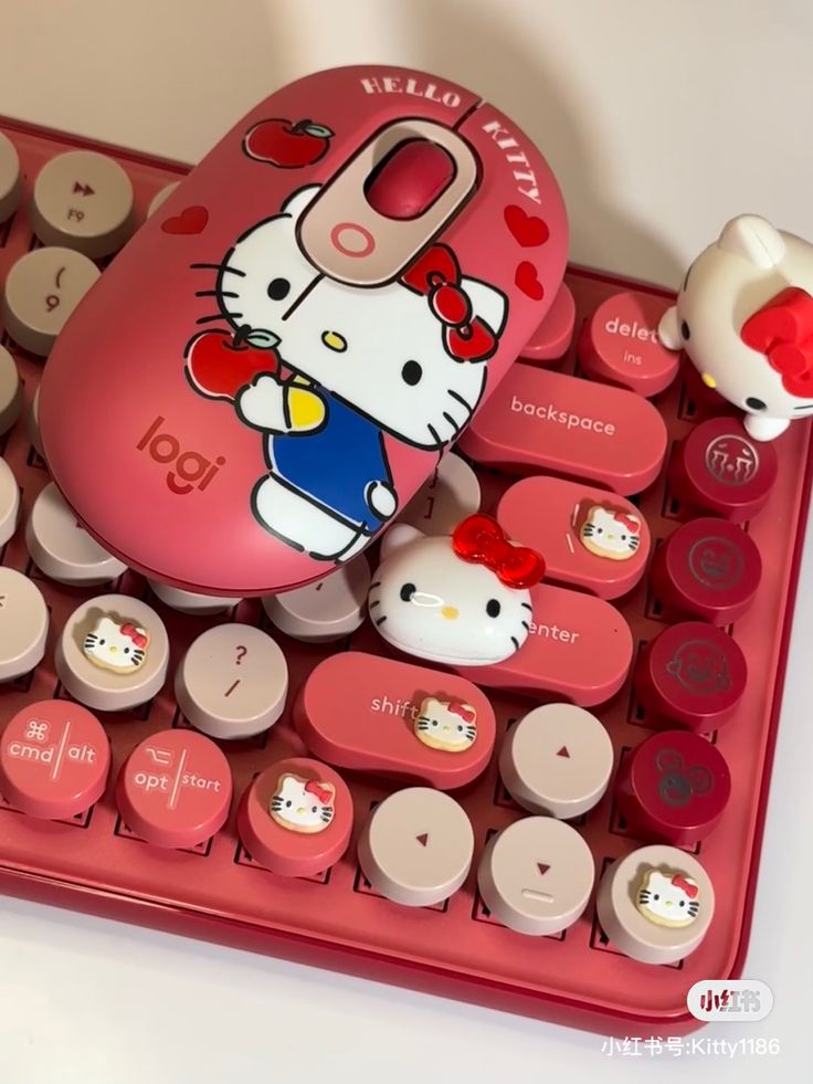 a keyboard with hello kitty characters on it