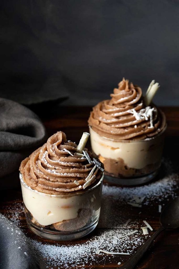 two desserts sitting on top of a wooden table