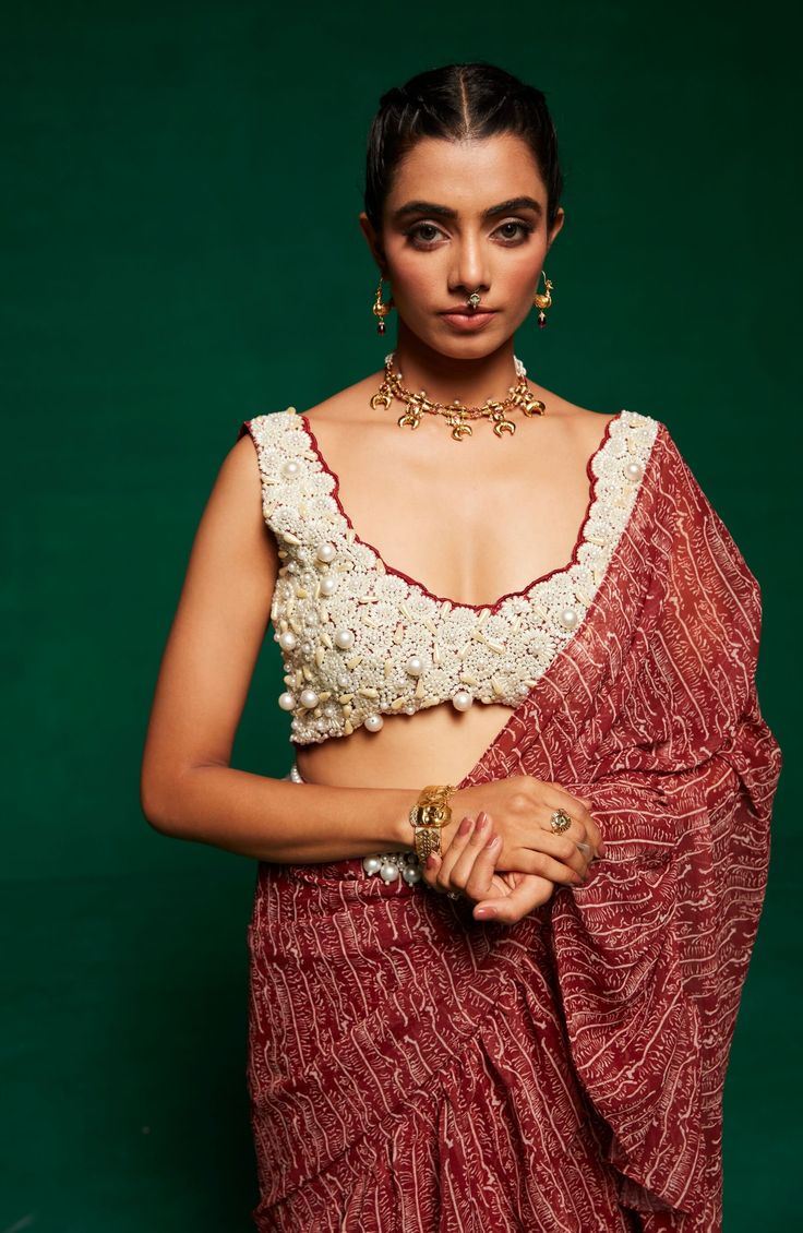 Step into the spotlight with Payal & Zinal's signature pre-draped ruffle sari. Paired with an intricately embroidered blouse and a pearl-adorned belt, this ensemble effortlessly combines modern flair with timeless elegance. Embroidered Blouse, Tan Brown, Timeless Elegance, Festival