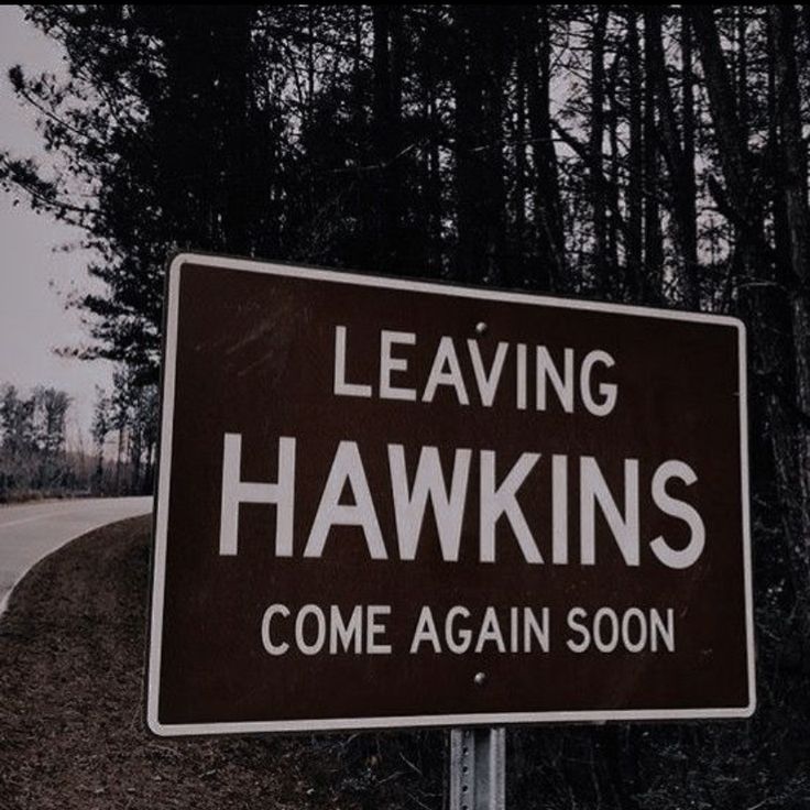 a sign that says leaving hawks come again soon on the side of the road in front of some trees