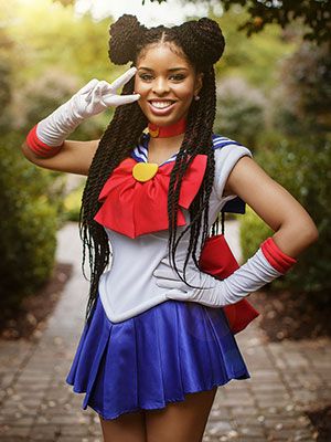 a woman dressed in a costume posing for the camera