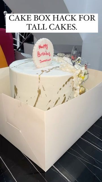 a birthday cake in a box with the words happy birthday written on it's side