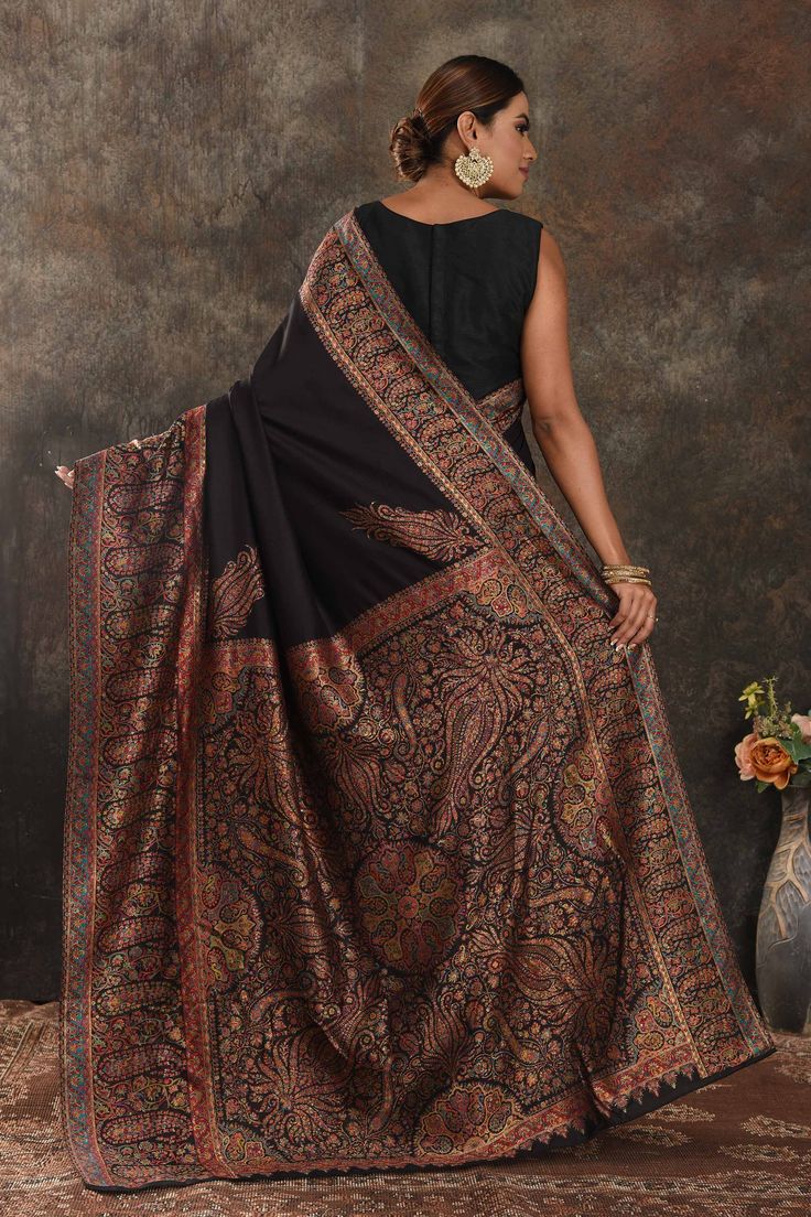 Exquisite black Kani weave tussar muga saree is one of a kind drape for a saree wardrobe! It comes with a matching blouse piece. Shop designer sarees in USA from Pure Elegance. The shown stitched blouse on the model is for display purpose only. The saree comes with a matching blouse piece and finished with fall and piko. Disclaimer: The actual product may vary slightly from the image. These are custom orders, hence expect slight variation in color, placement of the motif or buta. ESTIMATED DELIVERYBecause this is a custom order, it would take about 4 weeks from the date of purchase. RETURN POLICYThis product is a custom order and cannot be returned or exchanged. Indian Saree Blouses Designs Latest, Blouses Designs Latest, Kashmiri Saree, Latest Silk Sarees, Tussar Silk Sarees, Latest Designer Sarees, Indian Saree Blouse, Indian Saree Blouses Designs, Saree Blouse Designs Latest