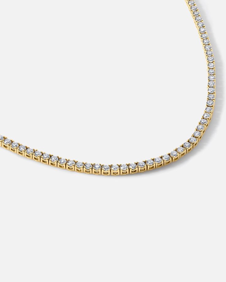 18K Polished Yellow & White Gold + Colorless VS Diamonds // An ode to fire and radiance, every one of ASTRID's pure, sparkling stones is hand selected to accentuate plays of light with exquisite fluidity. Crafted with a distinctly elegant sensibility in mind. Luxury Tennis Necklace With Prong Setting For Gift, Yellow Gold Cubic Zirconia Tennis Necklace For Wedding, Wedding Yellow Gold Cubic Zirconia Tennis Necklace, Elegant Yellow Gold Tennis Necklace With 17 Jewels, Luxury Yellow Gold Tennis Necklace For Anniversary, Gold Diamond Tennis Necklace For Weddings, Luxury Gold Solitaire Necklace With Prong Setting, Dazzling Gold Moissanite Necklaces, Gold Tennis Necklace With Prong Setting As Gift