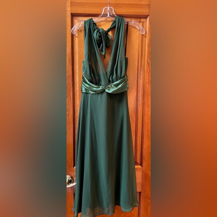 Halter Dress In Beautiful Green With Organza Top. Spring Midi Dress With Tie Back For Dinner, Tie Back Midi Evening Dress, Tie Back Midi Dress For Evening, Midi Length Tie Back Dress For Evening, Green Tie Back Mini Dress For Evening, Green Knee-length Dress With Tie Back, Green Sleeveless Midi Dress For Evening, Spring Tie Back Maxi Dress For Dinner, Green A-line Midi Evening Dress