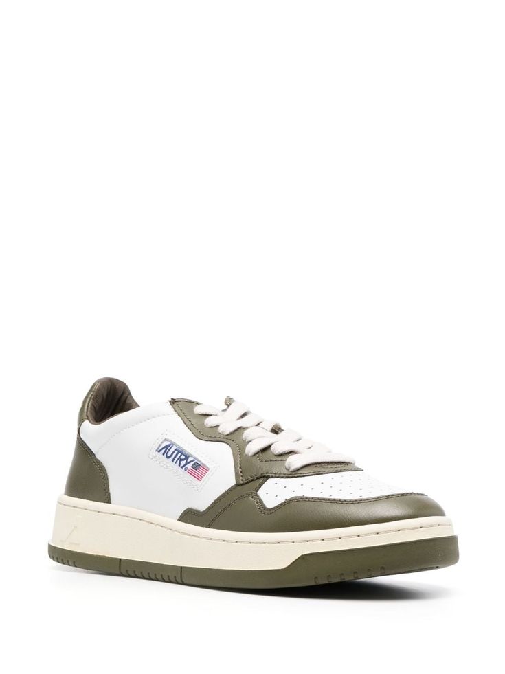 Medalist leather low-top sneakers from Autry featuring olive green, white, calf leather, two-tone design, perforated toebox, logo patch to the side, debossed logo to the rear, logo patch at the tongue, branded insole, round toe, front lace-up fastening and flat rubber sole. Size Info IT Color Detail Green Made In Indonesia Material Outer: Calf Leather 100% Sole: Rubber 100% Lining: Fabric 100%, Calf Leather 100% Season One Fall-Winter Season Two Fall-Winter Product sneakers Brand Autry Size And Sporty Leather Custom Sneakers With Logo Patch, Green Leather Sneakers With Contrast Sole, Leather Lace-up Sneakers With Logo Patch, Classic Green Sneakers With Contrast Sole, Leather Low-top Sneakers With Logo Patch, Green Leather Sneakers With Embossed Logo, Classic Green Low-top Sneakers, Sporty Leather Sneakers With Logo Patch, Classic Low-top Sneakers With Logo Patch