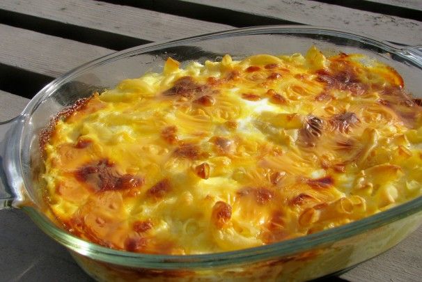 a casserole dish is sitting on a wooden table