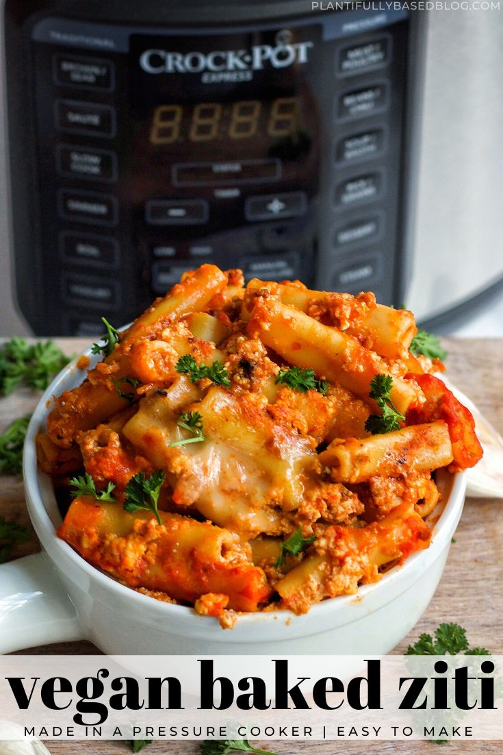 a white bowl filled with pasta and meat next to an instant pressure cooker