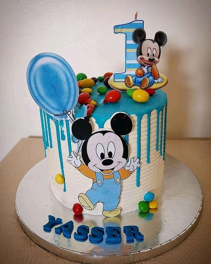 a mickey mouse birthday cake on a table