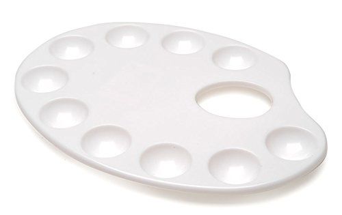 a white tray with twelve holes on it