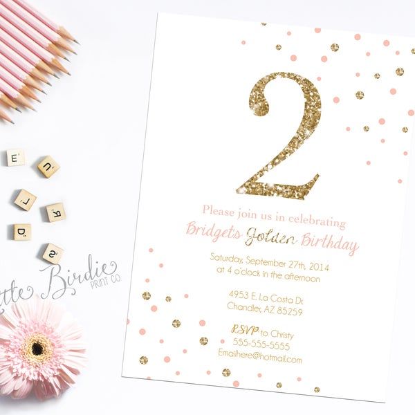 a pink and gold birthday card with the number two on it next to some pencils