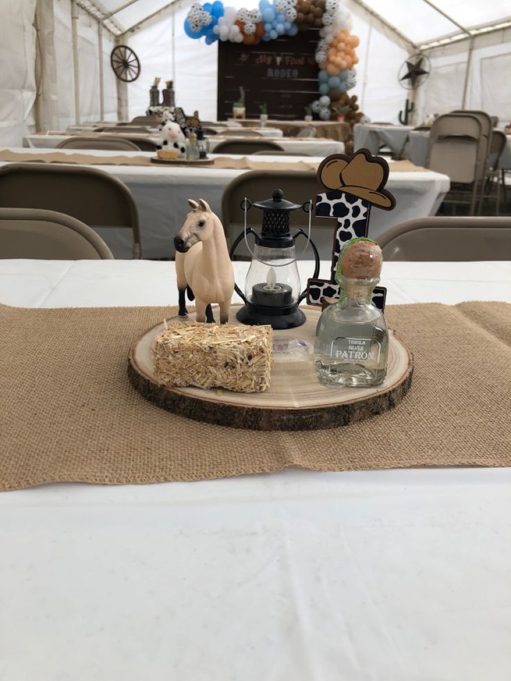 Western Birthday Centerpiece Ideas, Horses Centerpieces Party Ideas, Jaripeo Centerpieces, Vaquero Centerpiece Ideas, Vaquero Table Decor, Ranchero Centerpiece Ideas, Rodeo Table Setting, How The West Was One Centerpieces, Glam Rodeo Birthday Party