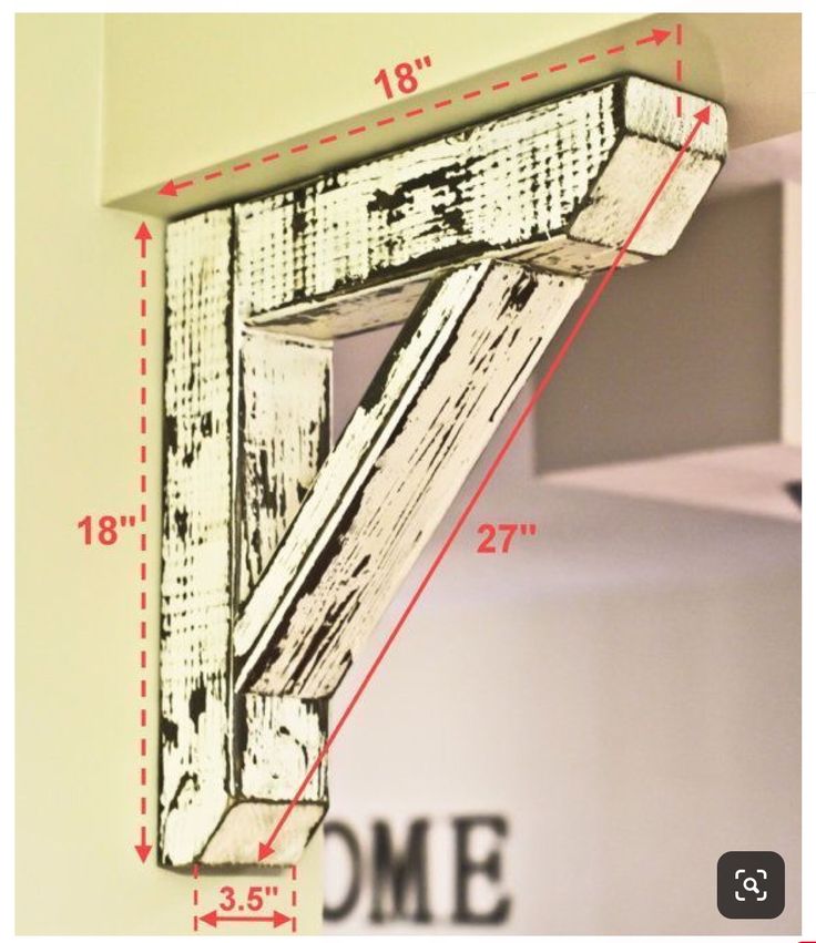 a wooden shelf with measurements for the top and bottom section, hanging on a wall