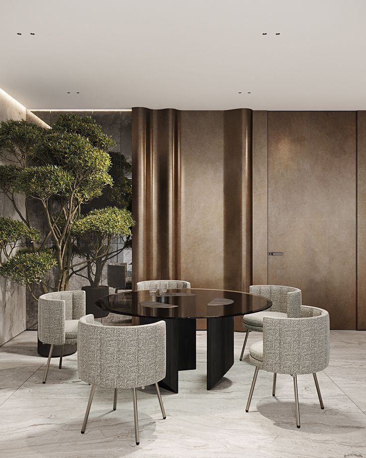 an elegant dining room with modern chairs and a round table in front of a wall