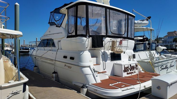 a boat docked at a dock with other boats