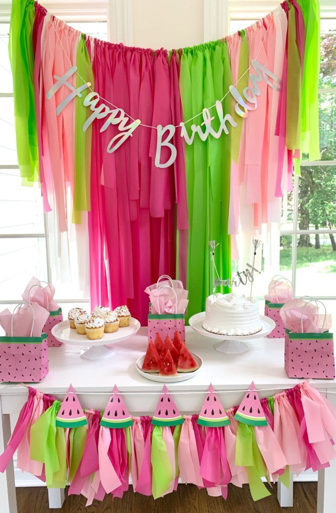 a watermelon themed birthday party with cake and decorations