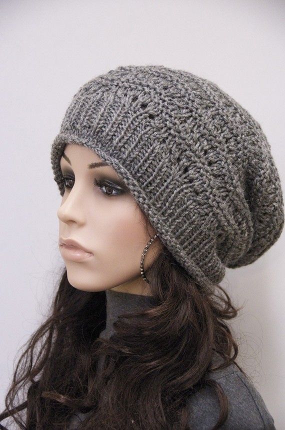 a mannequin head wearing a gray knitted hat