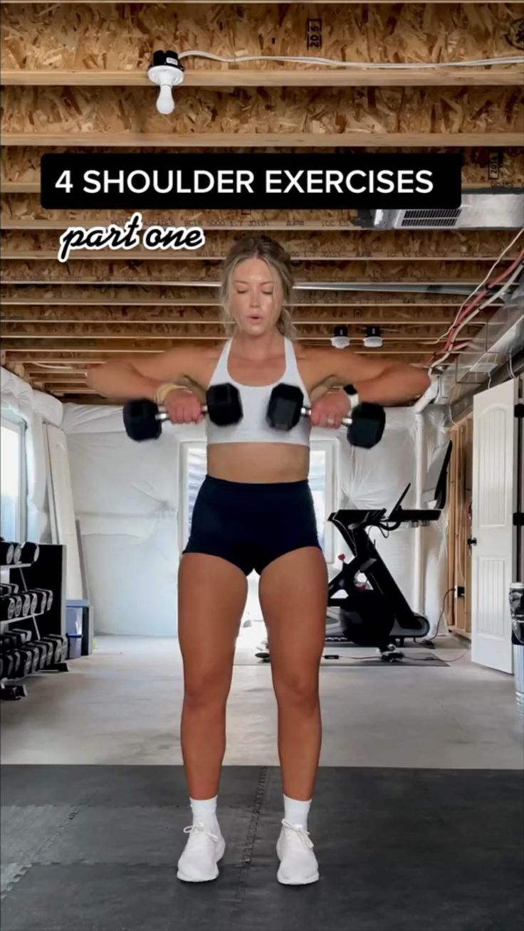 a woman is doing exercises with dumbbells in the gym and has her hands behind her back