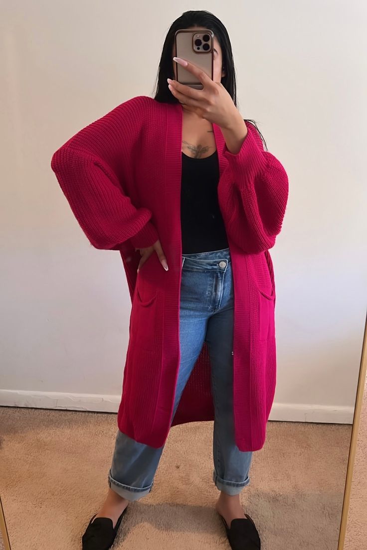 You'll always find yourself reaching for this Oversized Longline Cardigan. It's the perfect transitional piece, with an open front and pockets. It is meant to have a chunky, oversized, and relaxed fit for an effortlessly chic look with maximum comfort. Throw it on over your easy looks and let this cardigan do the work. One Size Fits US Small - XL Material: 100% AcrylicStretch: Does have stretchFit: Oversized fit.Model size: Style is One Size Fits most. Kalani normally wears a medium. Oversized Solid Sweater Coat With Pockets, Oversized Sweater Coat With Pockets, Oversized Open Front Solid Sweater Coat, Trendy Relaxed Fit Cardigan With Pockets, Trendy Long Sweater Coat With Pockets, Trendy Cardigan With Pockets For Loungewear, Trendy Chunky Knit Cardigan For Loungewear, Oversized Knit Sweater Coat With Pockets, Oversized Cozy Cardigan With Pockets