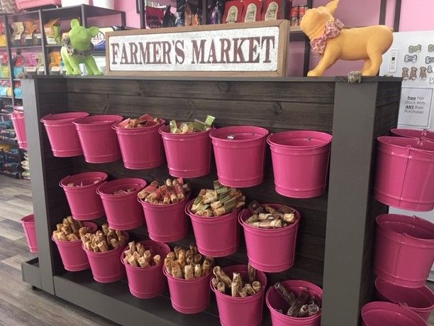 pink buckets on display in a toy store