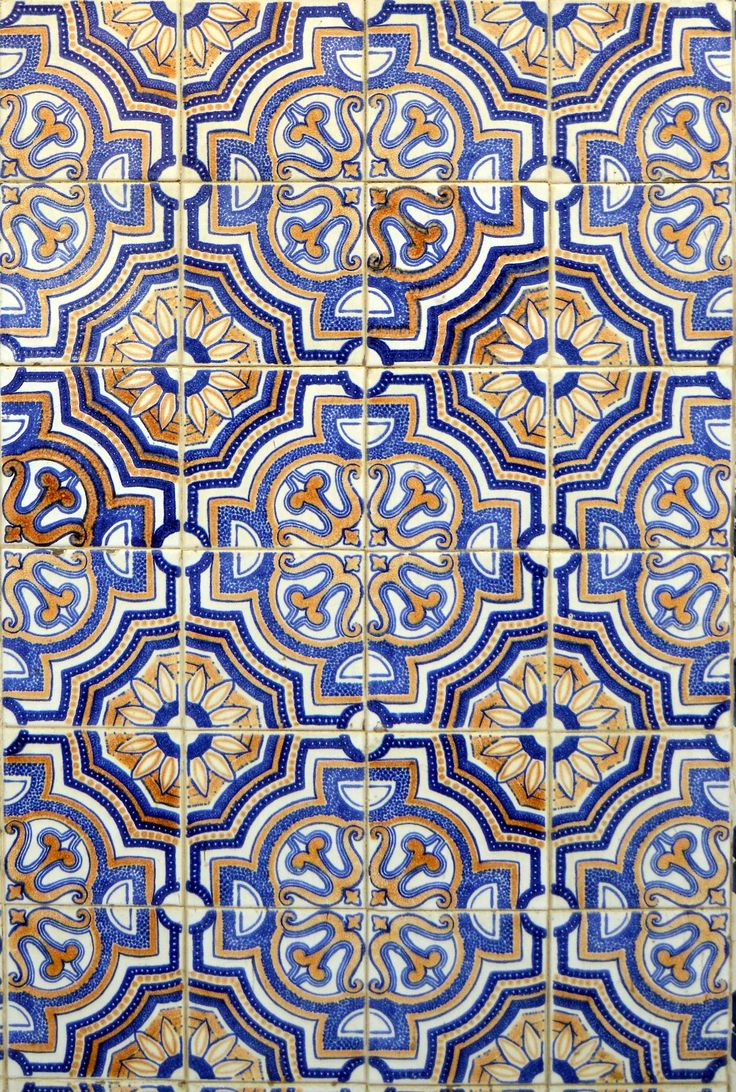 an intricate blue and gold tile pattern