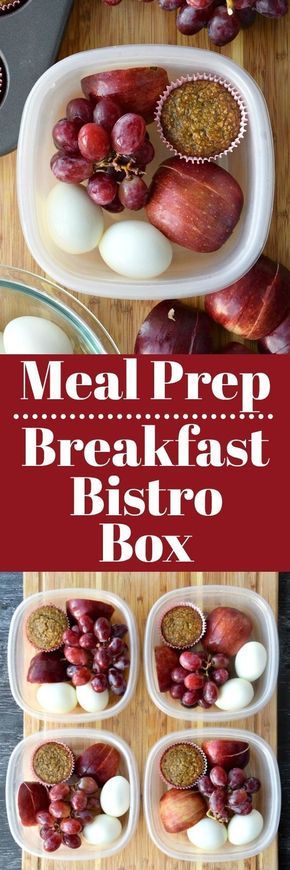 meat prep breakfast bistro box with eggs and other foods in plastic containers on a cutting board