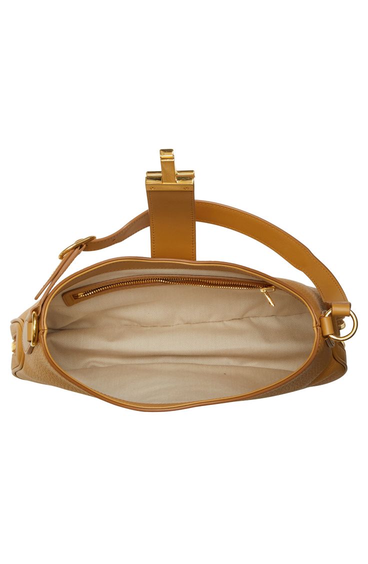 Signature T-shaped hardware details this slouchy hobo bag crafted of beautifully grained leather and finished with a bottom zip gusset to expand the capacity. Hook-tab closure Adjustable shoulder strap Interior zip pocket Bottom zip gusset Leather Made in Italy Designer Handbags Designer Everyday Hobo Bag With Zipper Closure, Designer Everyday Hobo Bag With Zipper, Everyday Designer Hobo Bag With Zipper Closure, Designer Hobo Bag With Zipper For Everyday, Designer Textured Leather Hobo Bag For Travel, Leather Hobo Bag With Gold-tone Hardware For Travel, Leather Hobo Bag With Gold-tone Hardware For Business, Luxury Pebbled Leather Hobo Bag With Gold-tone Hardware, Designer Textured Leather Hobo Shoulder Bag