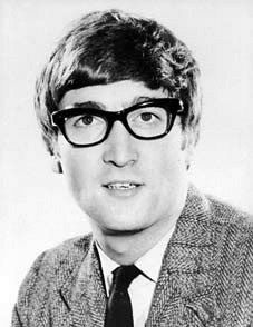 a black and white photo of a man wearing glasses