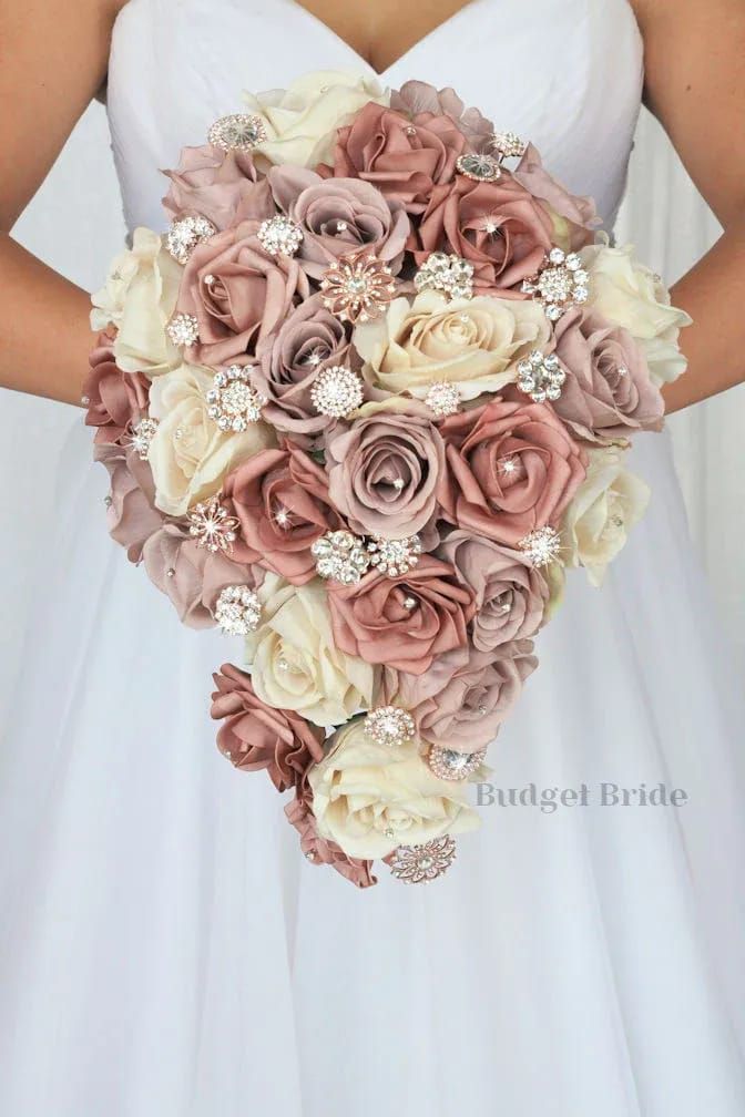 a bride holding a bouquet of flowers in her hands