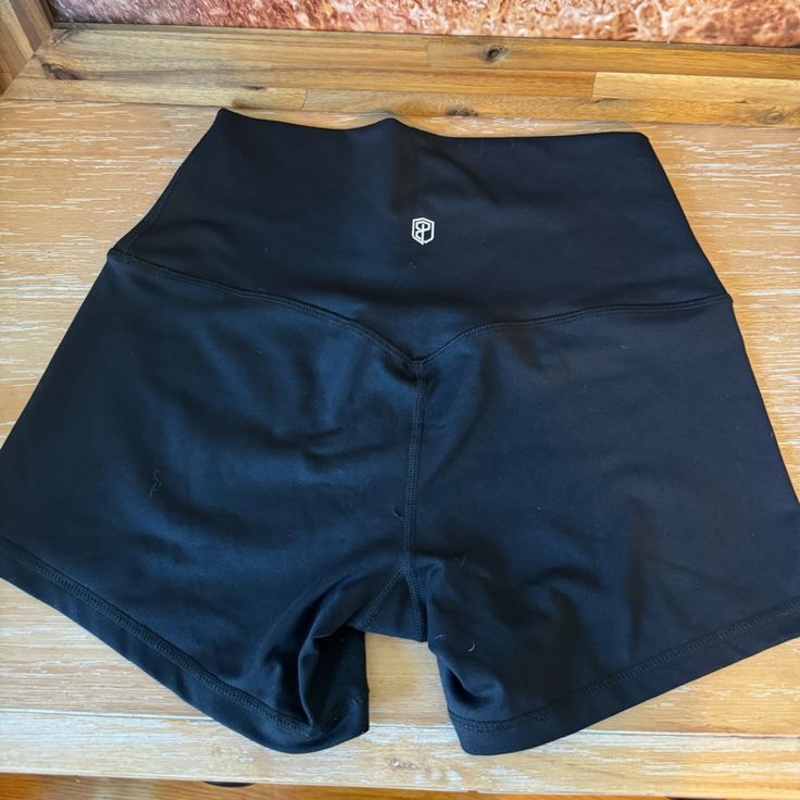 Never Worn, Black And Stretchy. High Waist Black Bottoms With Moisture-wicking, High Waist Moisture-wicking Black Bottoms, High Waist Black Moisture-wicking Bottoms, Black Compression Athletic Shorts With Elastic Waistband, Black Gym Bottoms With Built-in Shorts, Black High Waist Activewear With Elastic Waistband, Black High Waist Moisture-wicking Athletic Shorts, Black High-waisted Activewear With Elastic Waistband, Black Compression Athletic Shorts For Yoga