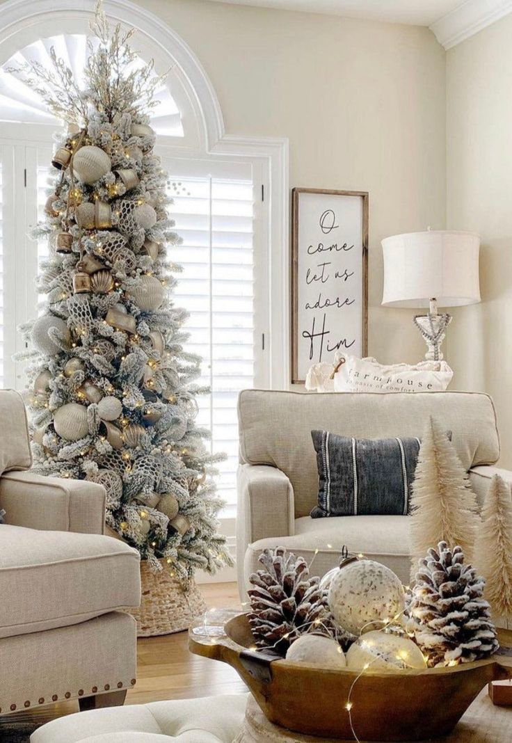 a living room filled with furniture and a christmas tree