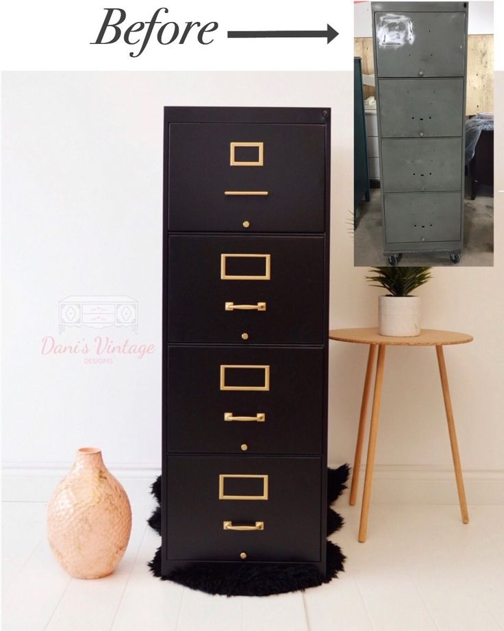 a black filing cabinet next to a white wall and a brown vase on the floor