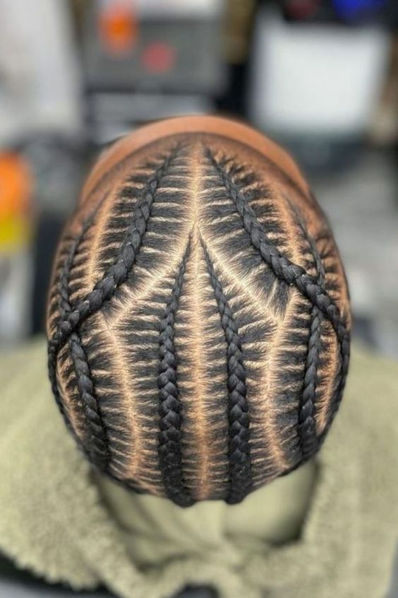 Here’s a recipe for one of the coolest braided hairstyles for men: Combine Dutch cornrow braids with a unique parting design. @fro.fosho Boy Braid Styles, Male Braids, Cornrow Braids Men, Hair Braid Patterns, Braid Styles For Men, Boy Braids Hairstyles, Cornrow Hairstyles For Men