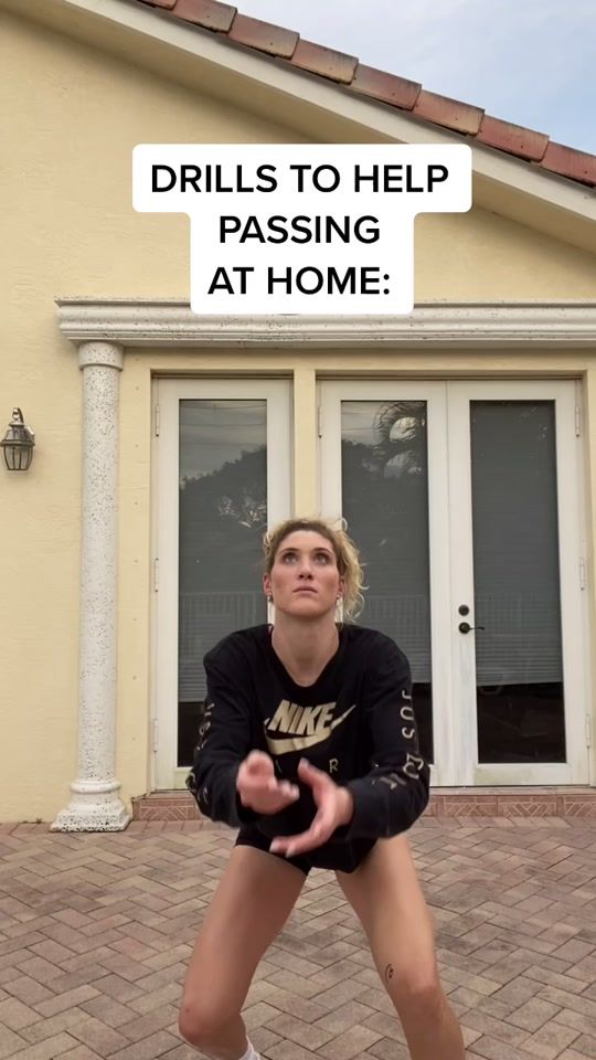 a woman is standing in front of a house with her hands out and the words drills to help passing at home