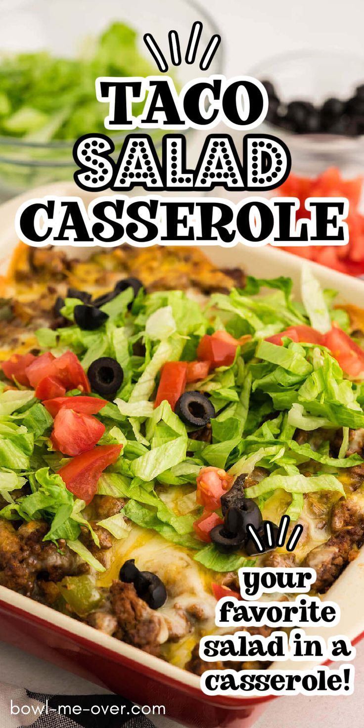 a taco salad casserole with lettuce, tomatoes and black olives