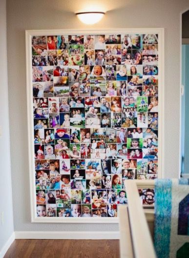 a wall covered in photos and pictures next to a doorway