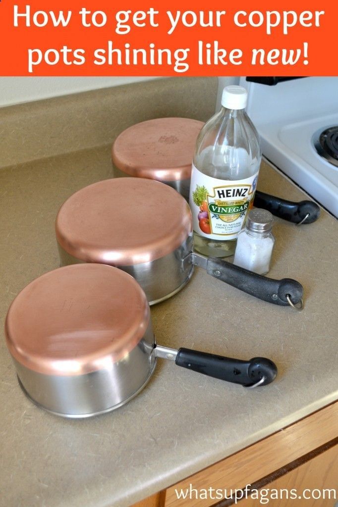 three pots sitting on top of a counter next to an oven with cooking utensils