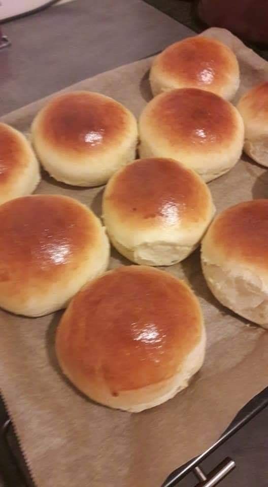 bread rolls on a baking sheet ready to be baked