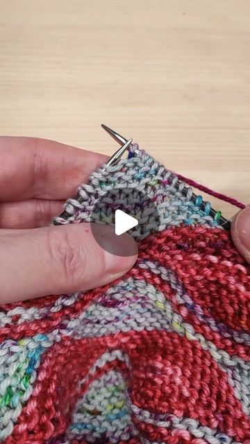 someone is stitching something on a piece of fabric