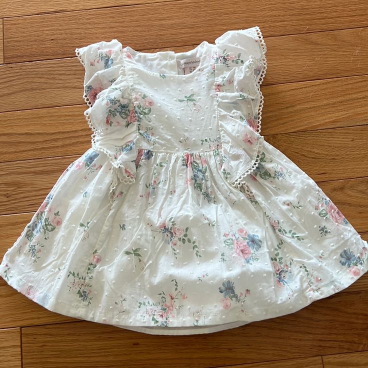 This Dress Is The Sweetest. My Daughter Outgrew Size 12months Before She Could Even Wear This. I Hope Someone Else Can Get Use Out Of It. Would Make A Perfect Birthday Dress Or Special Occasion Dress. Playdate Flutter Sleeve Dress, Cotton Ruffle Dress For First Birthday, Sweet Cotton Dress For Playtime, Sweet Cotton Playtime Dress, Spring Ruffled Dress For First Birthday, Spring Dresses With Ruffles For First Birthday, Sweet Cotton Dress For Playdate, Sweet Cotton Dresses With Floral Print, Short Sleeve Dress For First Birthday In Spring