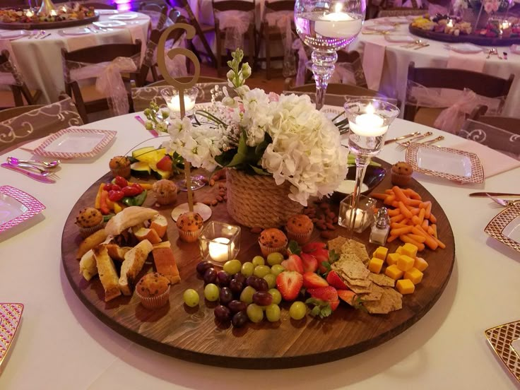 a wooden platter filled with lots of food