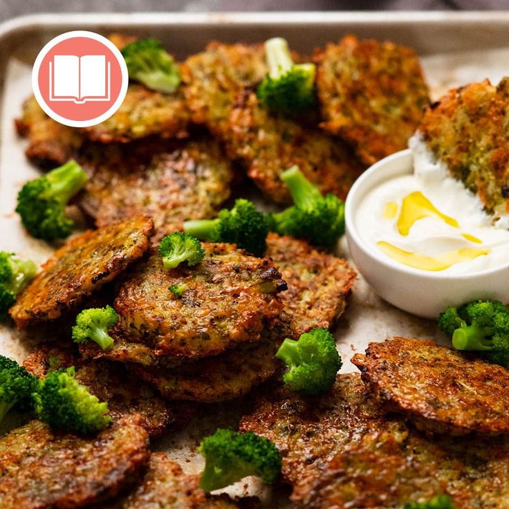 broccoli florets and other food items on a tray