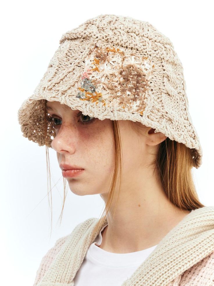 a woman wearing a hat with sequins on it