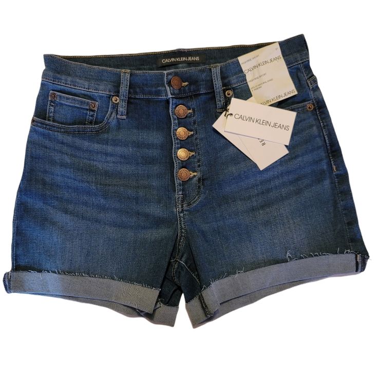 Calvin Klein High Rise Denim Shorts. Size 27 Color Core Denim High Rise 5 Pocket Construction 5 Button Fly Closure Stretch Repreve Sits At Natural Waist 4" Inseam Measurements And Material In Pics Nwt Calvin Klein Fitted Casual Shorts, Spring Calvin Klein Mid-rise Bottoms, Calvin Klein Fitted Shorts, Calvin Klein Spring Shorts, Calvin Klein High Waist Casual Bottoms, Mid-rise Denim Blue Shorts With Button Closure, Mid-rise Jean Shorts With Buttons, Calvin Klein High Waist Spring Bottoms, Calvin Klein High Waist Bottoms For Spring