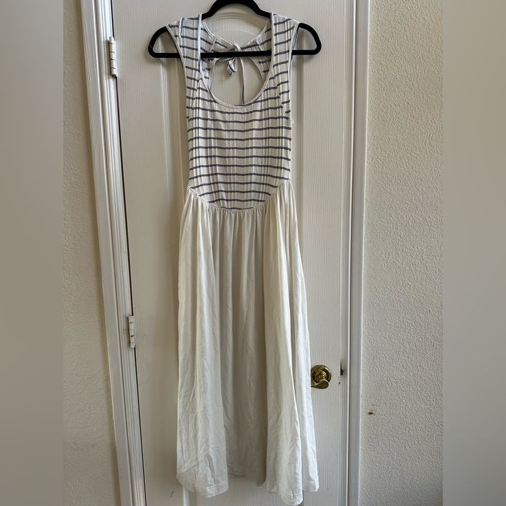 Free People Beach Alana Open Back Striped Midi Dress. Size: Xs Fit: Slim At The Bodice With A-Line Skirt Features: Scoop Neckline, Striped Bodice Detail, Tie-Back Keyhole Feature, Billowy Skirt Design With Side Pockets Style No. 83396655 Striped Summer Dresses For Daytime, Summer Striped Dresses For Daytime, Sleeveless Midi Dress For Beach Daytime, Sleeveless Midi Dress For Daytime Beach Season, Beach Season Daytime Maxi Sundress, Casual Maxi Length Sundress For Daytime, Casual Maxi Sundress For Daytime, Casual White Cotton Beach Dress, Casual Beach Dress For Daytime