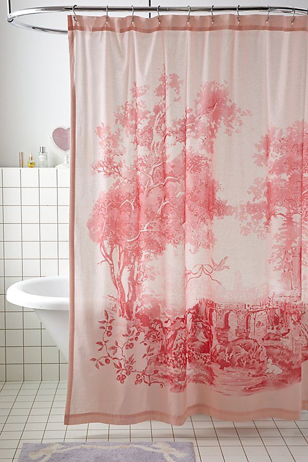 a pink shower curtain in a bathroom