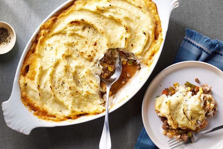 a casserole dish with mashed potatoes and meat