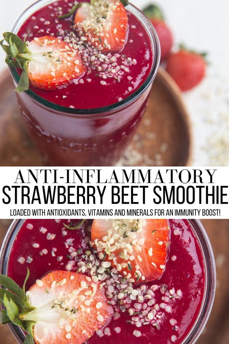 two glasses filled with strawberry beet smoothie and topped with strawberries